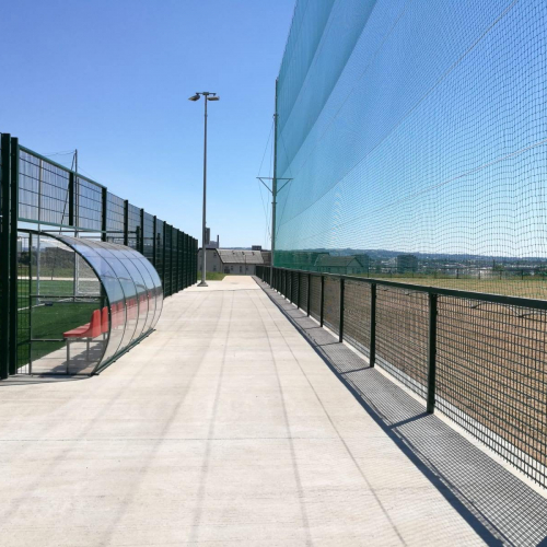 Small perimeter fence at the Michael Davitts GAC sports ground. View from within the ground.