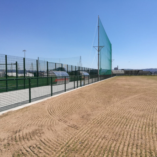 a wider shot of the spectator railing and fencing at the Michael Daviitts GAC pitch